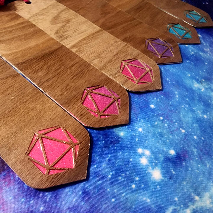 Wooden bookmarks with d20 cutout.